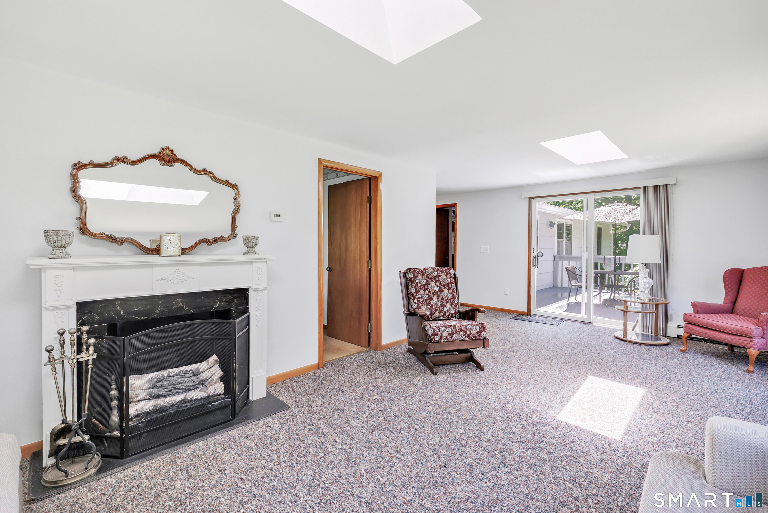 223 Wheeler Road Monroe, CT 06468 - Photo 12 of 35 a living room with furniture and a fireplace