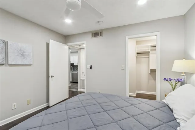 a bedroom with a bed and a table in it