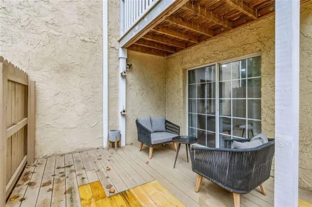 a bathroom with a sink mirror and shower