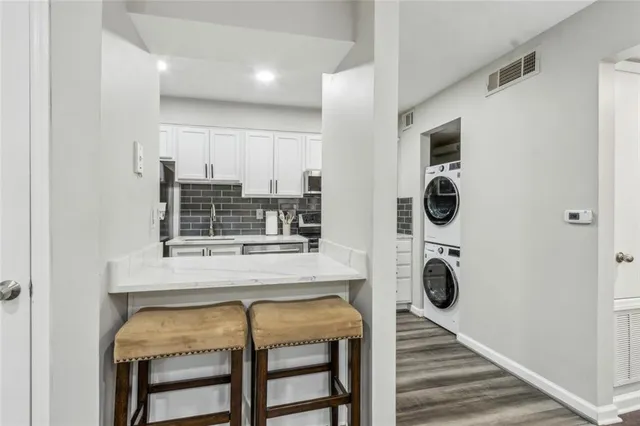 a kitchen with a table and chairs in it