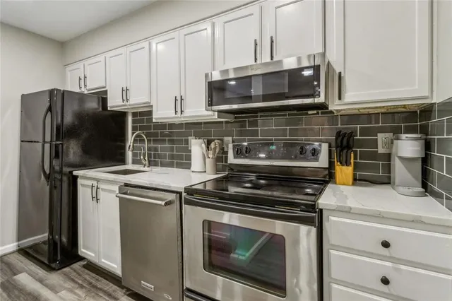 a kitchen with a stove and a microwave