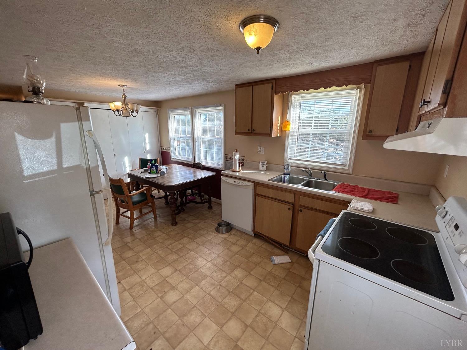 539 Carwile Road Rustburg, VA 24588 - Photo 11 of 21 a kitchen that has a sink and a stove in it