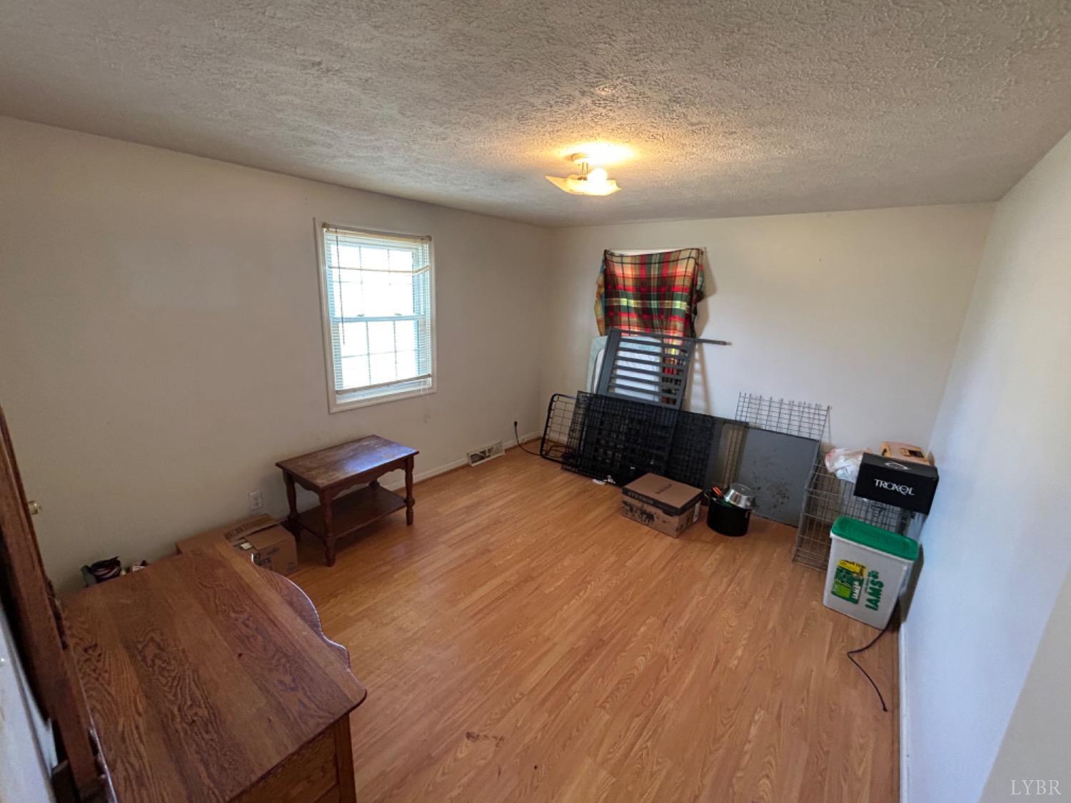 539 Carwile Road Rustburg, VA 24588 - Photo 18 of 21 a room with furniture and a window