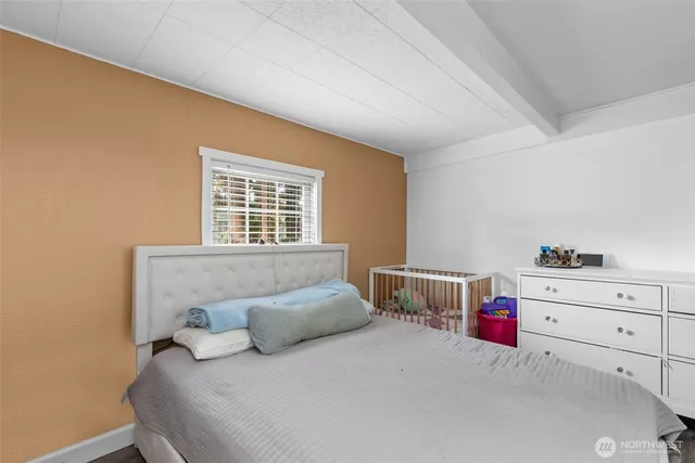 a bedroom with a bed and a closet