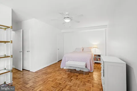 a bedroom with a bed and a cabinets