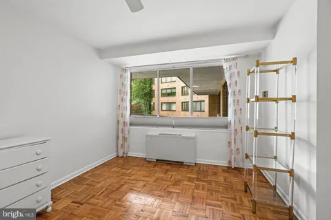 a room with a bed and a window