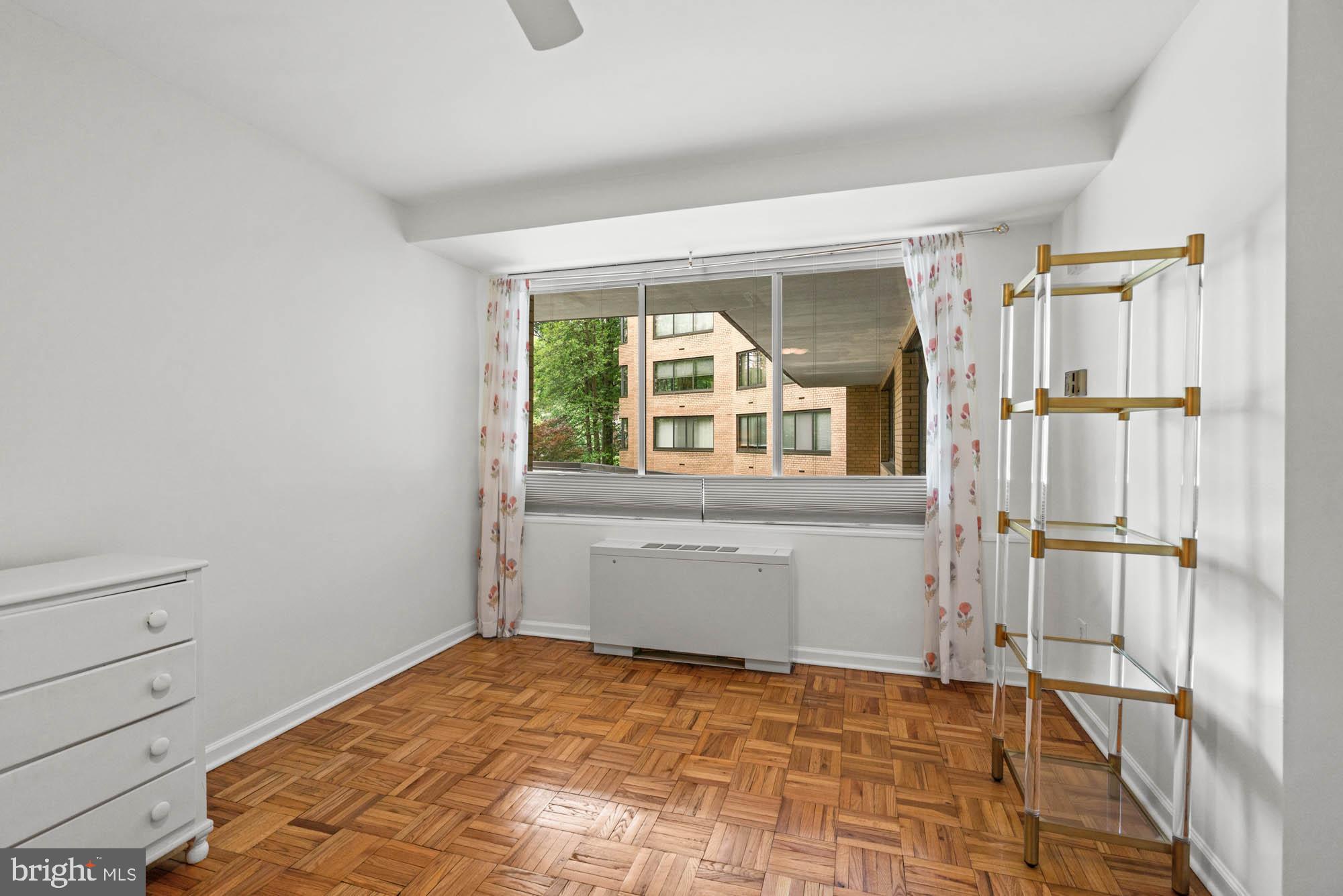 4740 Connecticut Avenue Northwest, Unit 204 Washington, DC 20008 - Photo 21 of 33 a room with a bed and a window