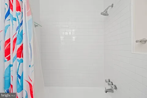 a bathroom with a shower curtain