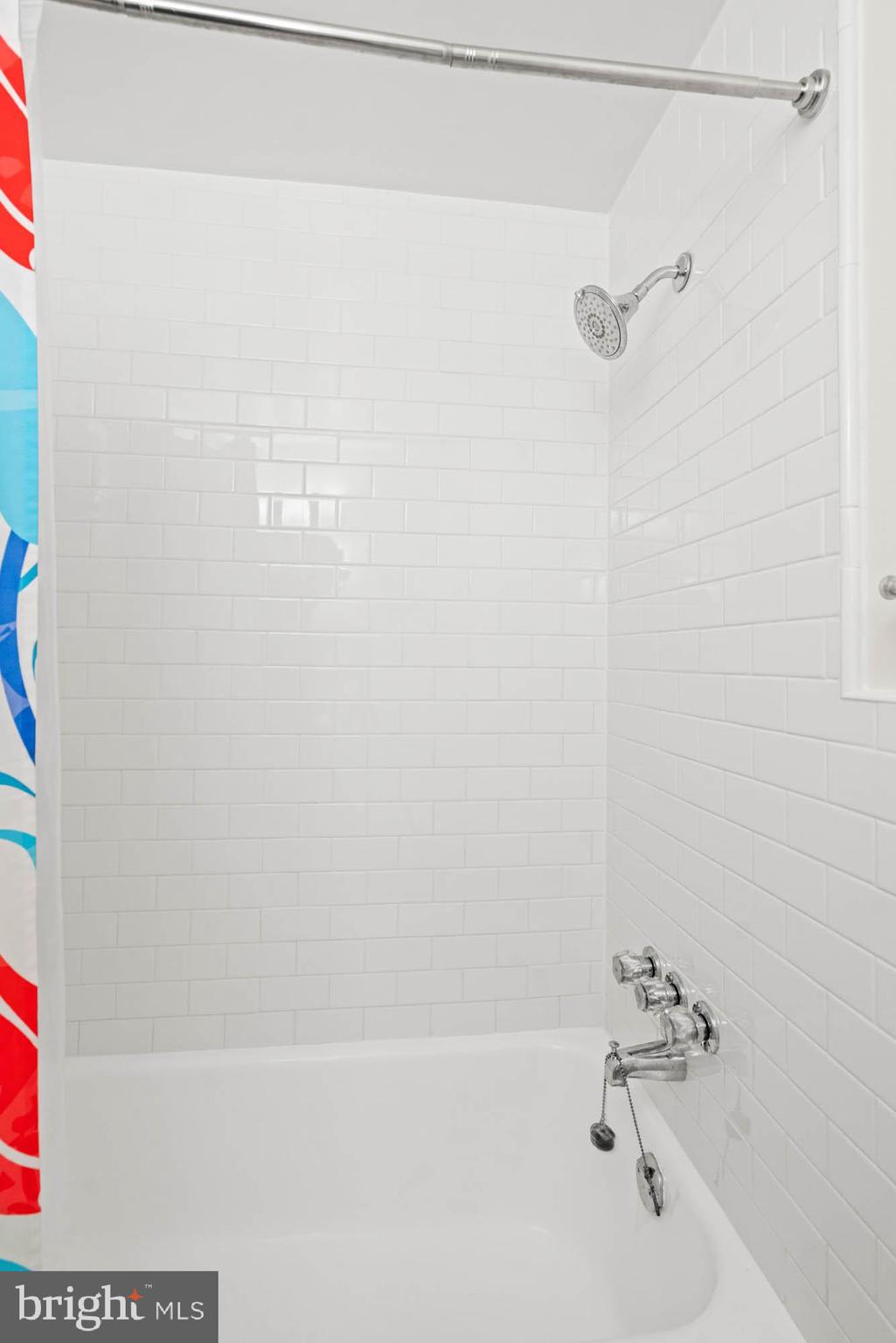 4740 Connecticut Avenue Northwest, Unit 204 Washington, DC 20008 - Photo 26 of 33 a bathroom with a shower