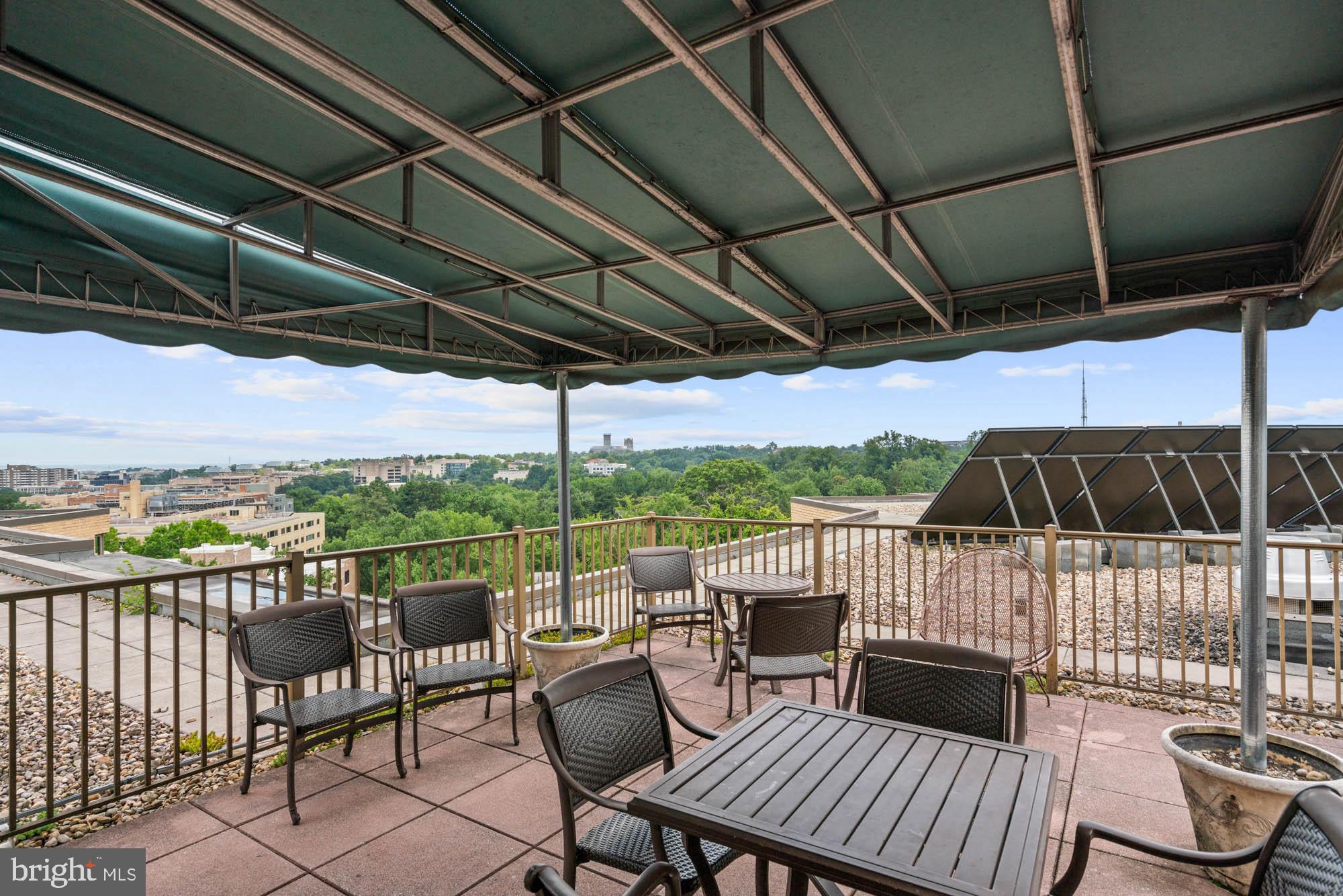 4740 Connecticut Avenue Northwest, Unit 204 Washington, DC 20008 - Photo 30 of 33 a view of a chairs and table in patio