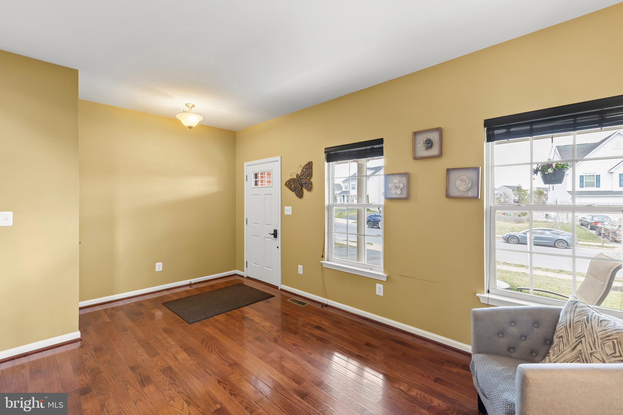 155 Merlot Drive Stephenson, VA 22656 - Photo 12 of 69 a view of empty room with wooden floor and fan