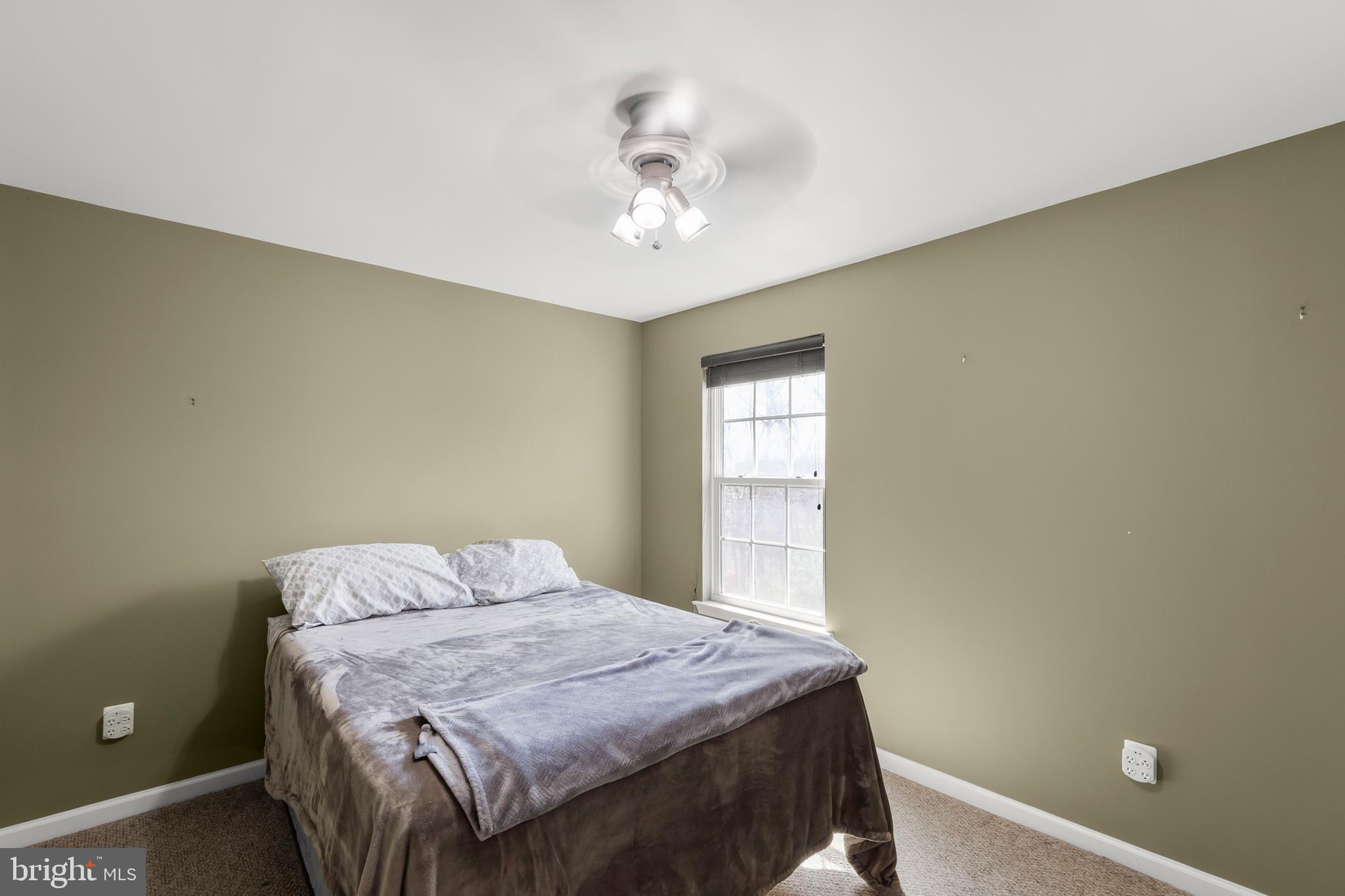 155 Merlot Drive Stephenson, VA 22656 - Photo 25 of 69 a bedroom with a bed and a chandelier