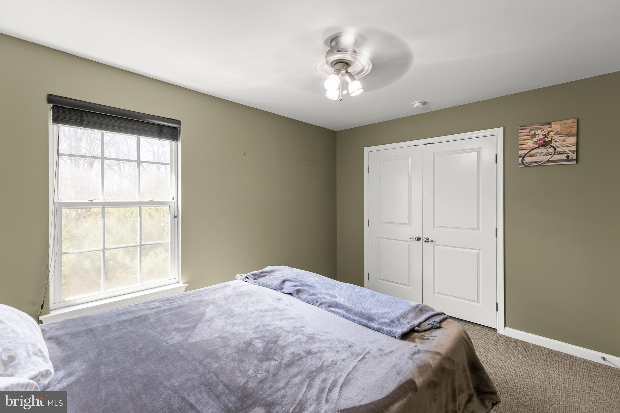 155 Merlot Drive Stephenson, VA 22656 - Photo 26 of 69 a bedroom with a bed and a chandelier