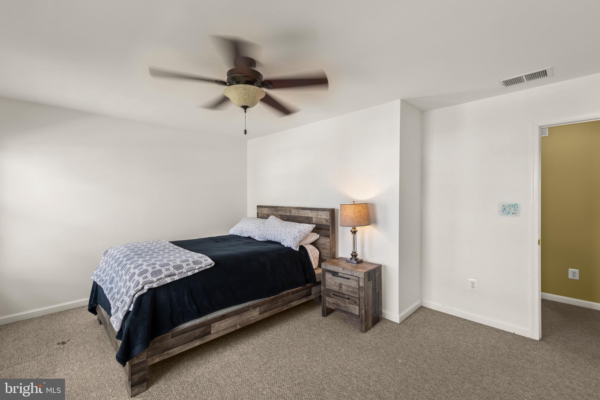 155 Merlot Drive Stephenson, VA 22656 - Photo 29 of 69 a bedroom with a bed and a table