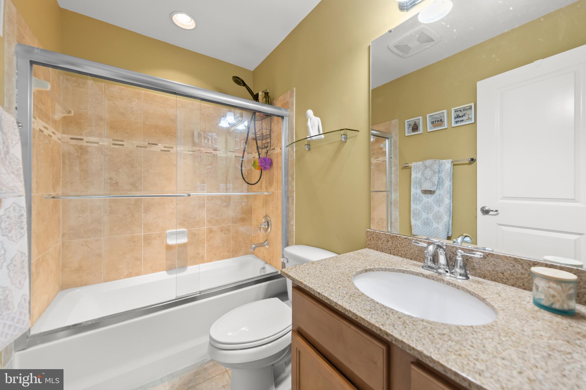 155 Merlot Drive Stephenson, VA 22656 - Photo 38 of 69 a bathroom with a granite countertop sink toilet and shower