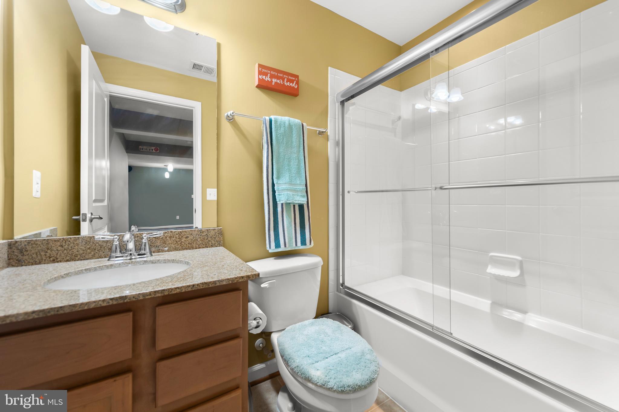 155 Merlot Drive Stephenson, VA 22656 - Photo 45 of 69 a bathroom with a sink a toilet and shower