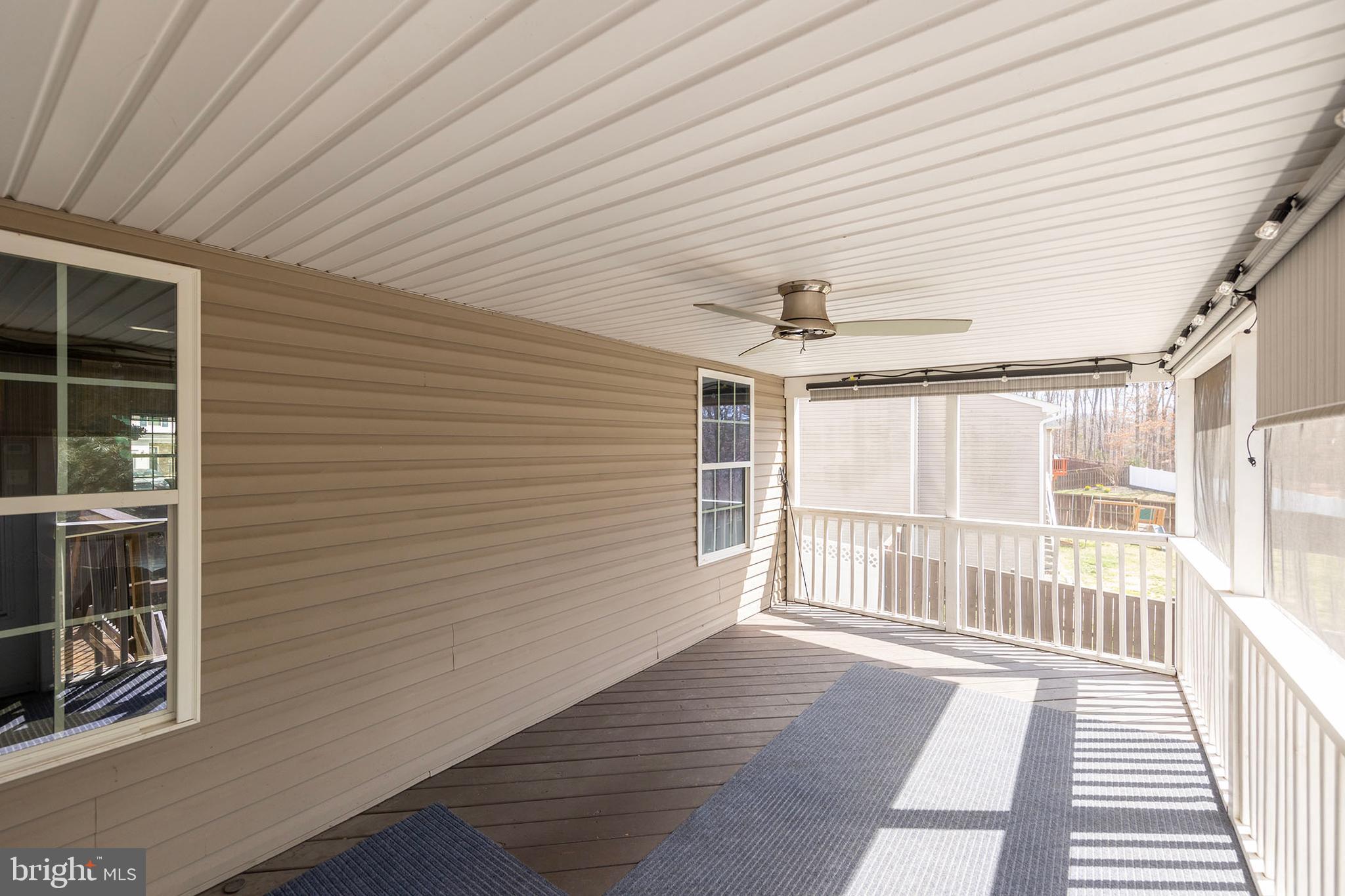 155 Merlot Drive Stephenson, VA 22656 - Photo 56 of 69 a view of a porch with wooden floor and fence