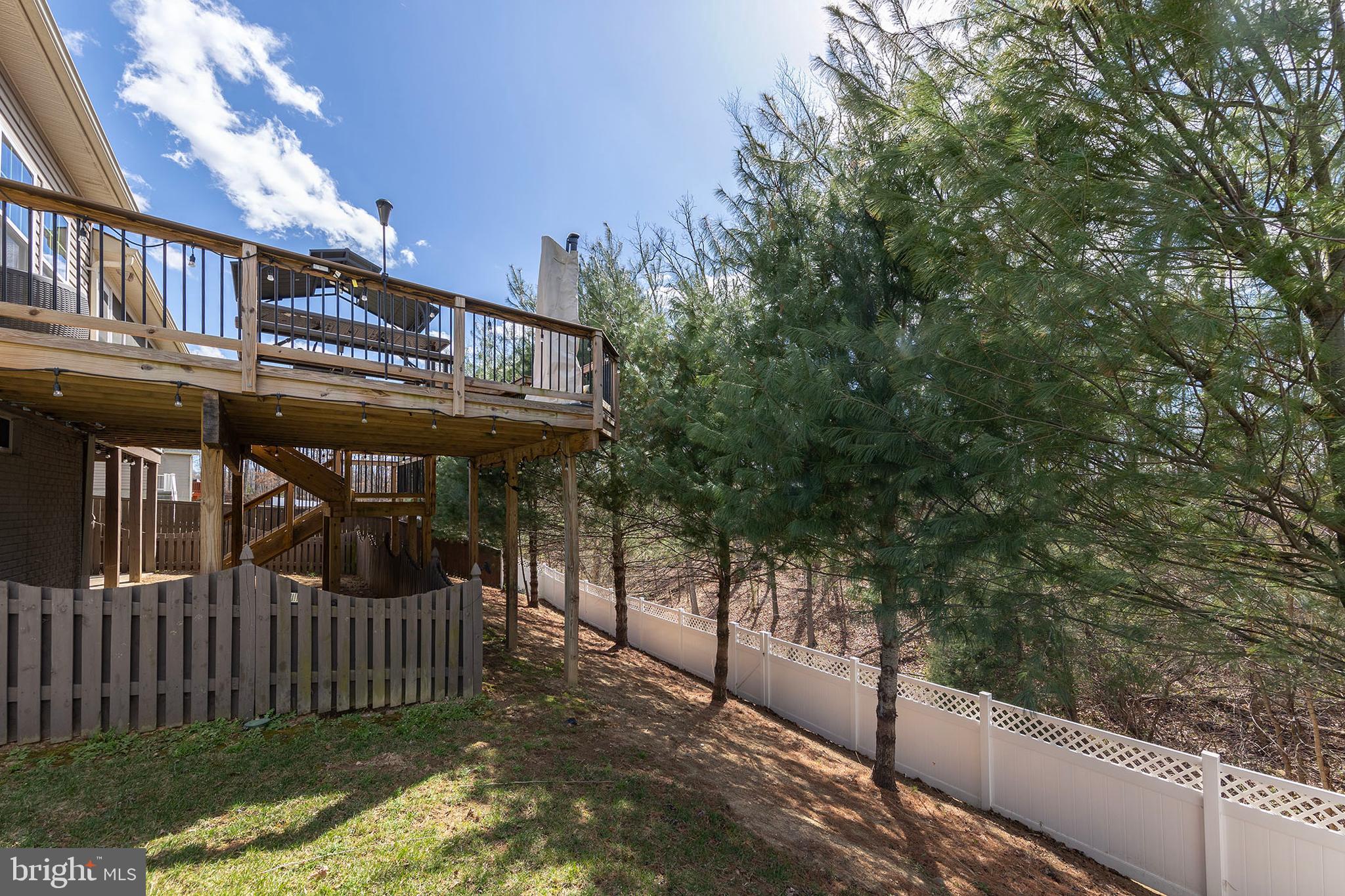 155 Merlot Drive Stephenson, VA 22656 - Photo 66 of 69 a view of a house with a small yard and wooden fence