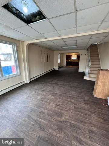 a view of an empty room with a fireplace