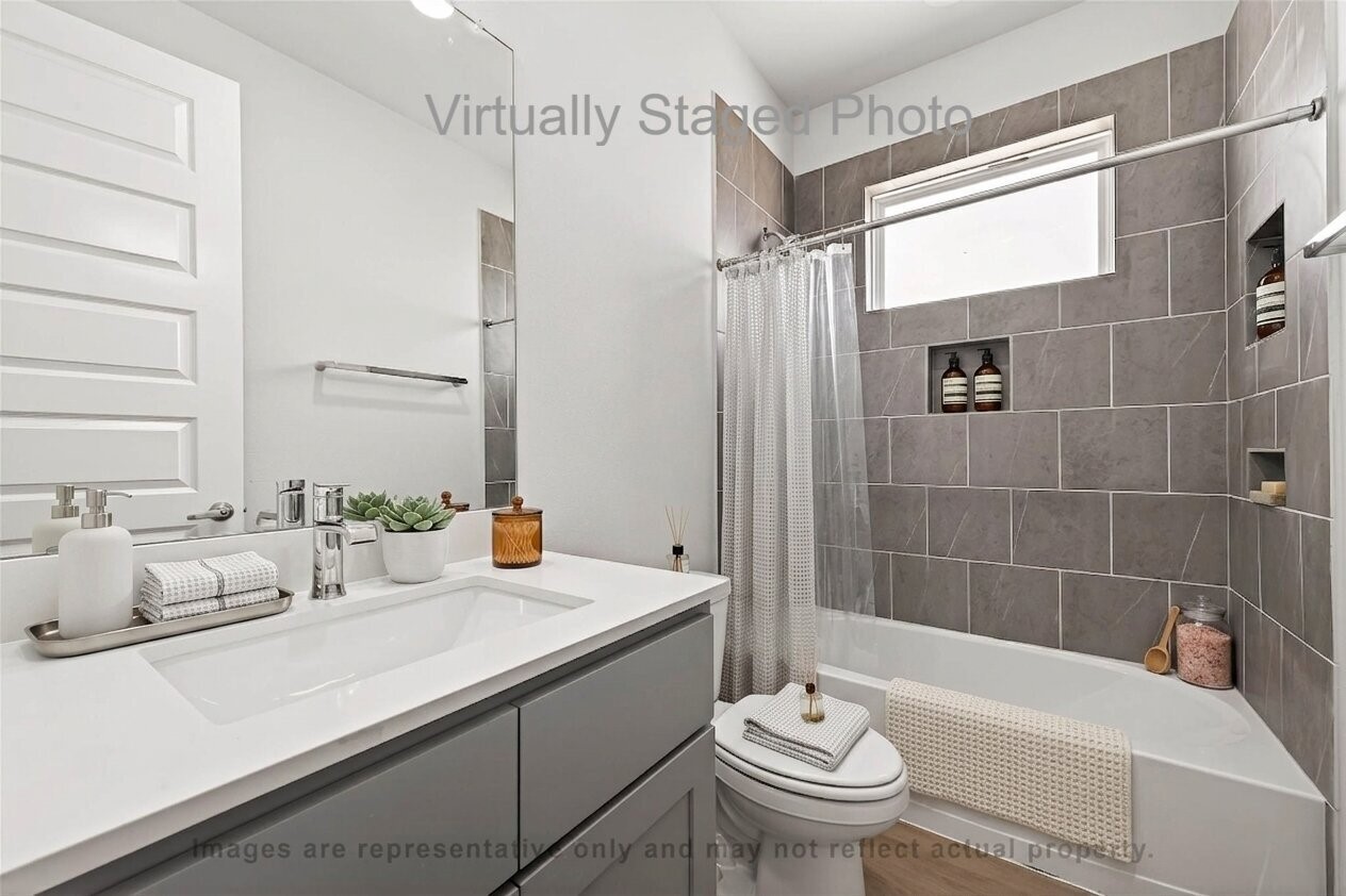 10719 Mason Road, Unit 15 Richmond, TX 77406 - Photo 24 of 50 Virtual Staging - Modern bathroom featuring a gray vanity, a large mirror, and a shower-tub combination with a gray tile surround