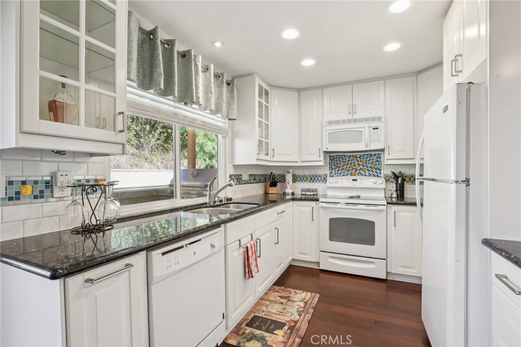 27191 Valleymont Road Lake Forest, CA 92630 - Photo 2 of 37 a kitchen with stainless steel appliances granite countertop a sink a stove and a refrigerator