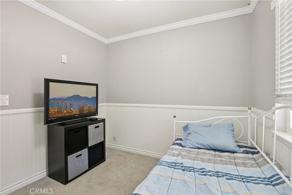 27191 Valleymont Road Lake Forest, CA 92630 - Photo 22 of 37 a bedroom with a bed and a painting on the wall