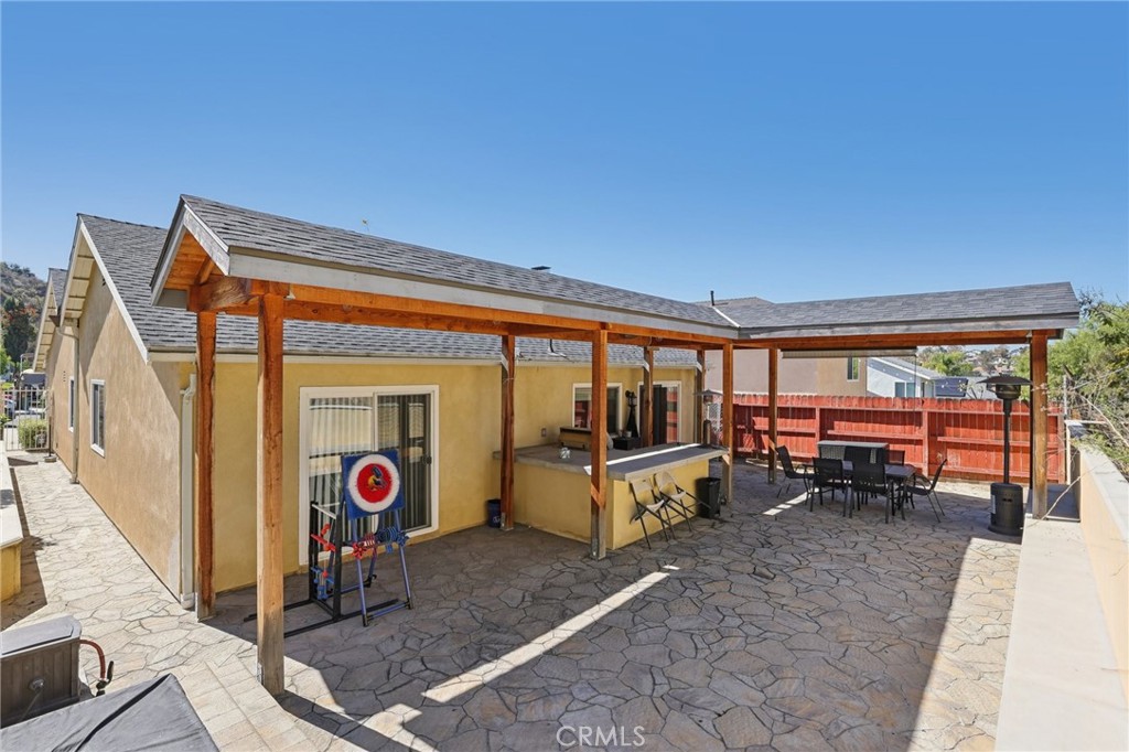 27191 Valleymont Road Lake Forest, CA 92630 - Photo 24 of 37 a backyard of a house with yard table and chairs