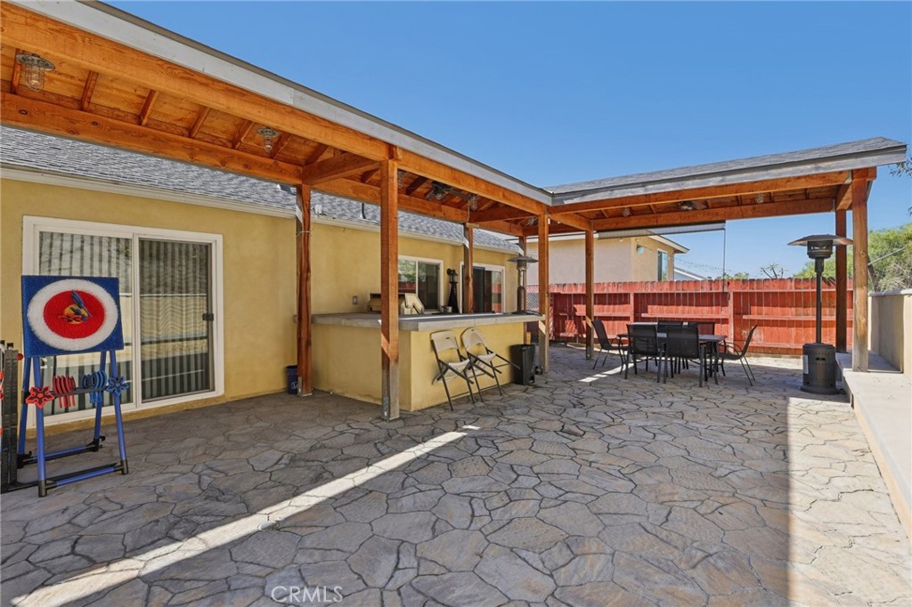 27191 Valleymont Road Lake Forest, CA 92630 - Photo 28 of 37 a view of a chairs and table in the backyard