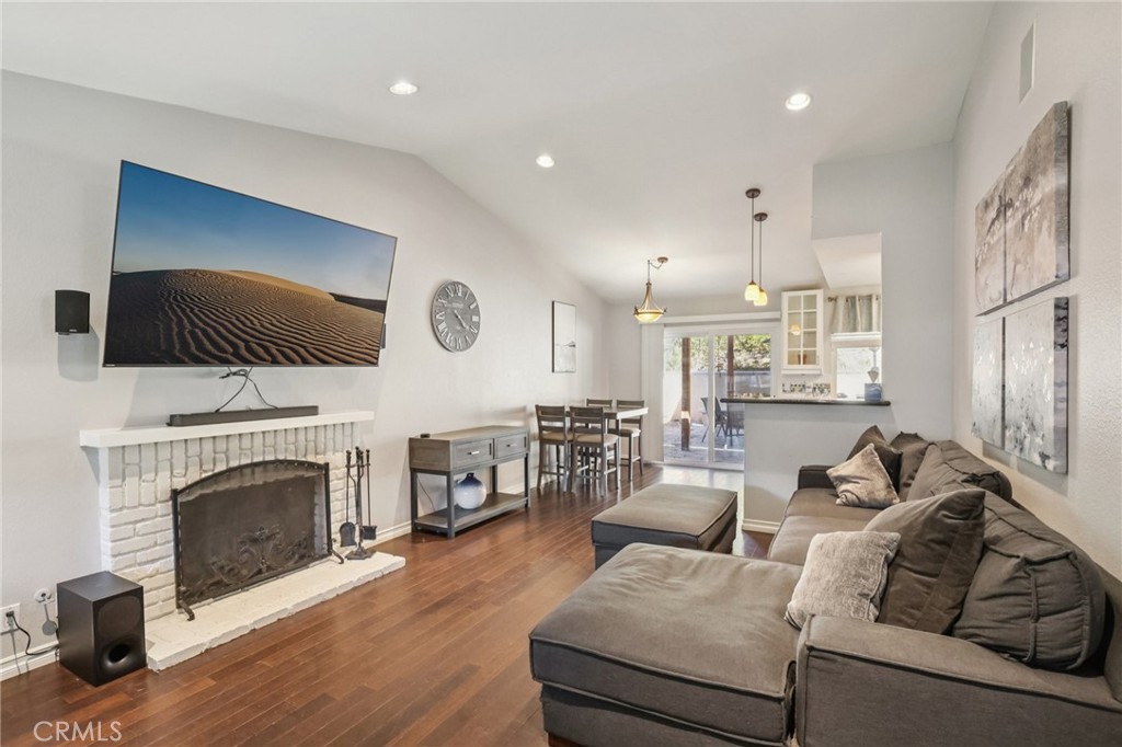 27191 Valleymont Road Lake Forest, CA 92630 - Photo 9 of 37 a living room with furniture and a fireplace
