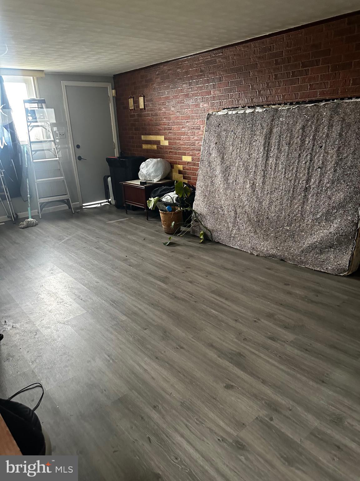 6110 Talles Road Baltimore, MD 21207 - Photo 4 of 31 a living room with furniture and a wooden floor