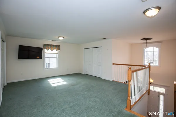 a view of empty room with windows