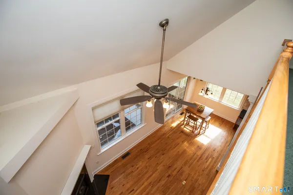 a view of a floor to ceiling window with wooden floor