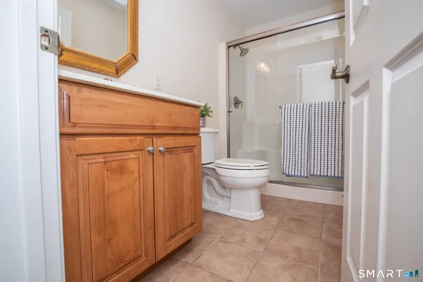 a bathroom with a shower and a toilet