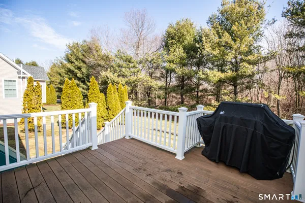 a view of a balcony with wooden floor