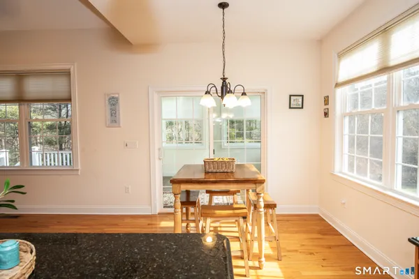 a view of a room with a table and chairs