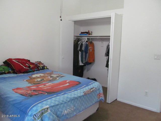 7905 West Thunderbird Road, Unit 308 Peoria, AZ 85381 - Photo 6 of 18 guest bedrrom and closet