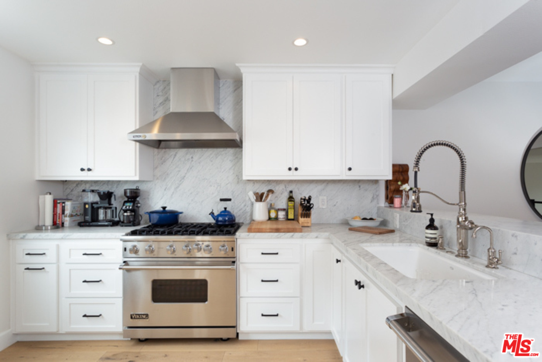 4425 Alla Road, Unit 6 Marina del Rey, CA 90292 - Photo 14 of 35 a kitchen with stainless steel appliances granite countertop a sink a stove and cabinets