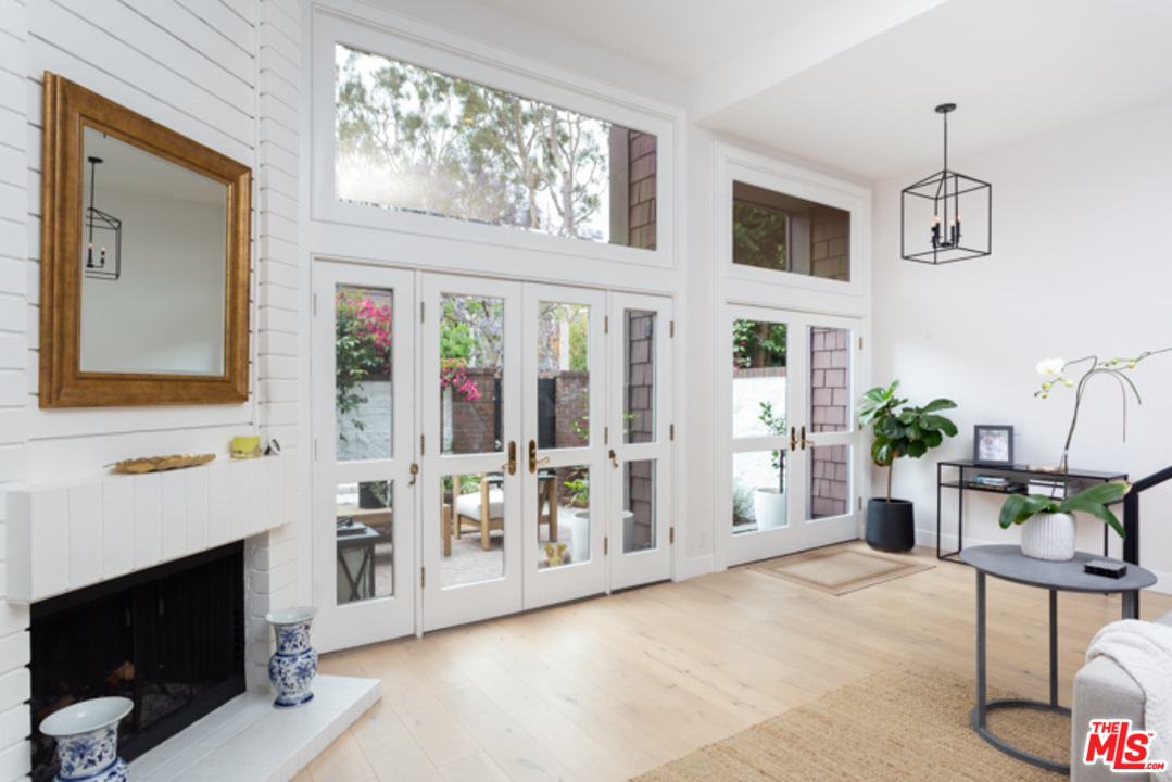 4425 Alla Road, Unit 6 Marina del Rey, CA 90292 - Photo 5 of 35 a living room with furniture a fireplace and a window