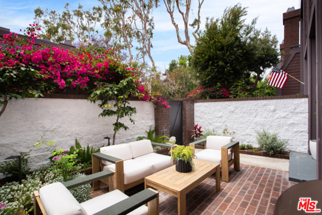 4425 Alla Road, Unit 6 Marina del Rey, CA 90292 - Photo 7 of 35 a view of a house with a yard and sitting area