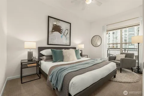 a bedroom with a bed and lamp with window