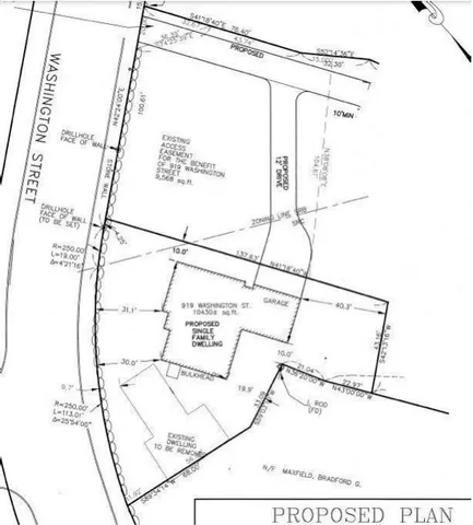 a picture of a room with a white wall and table