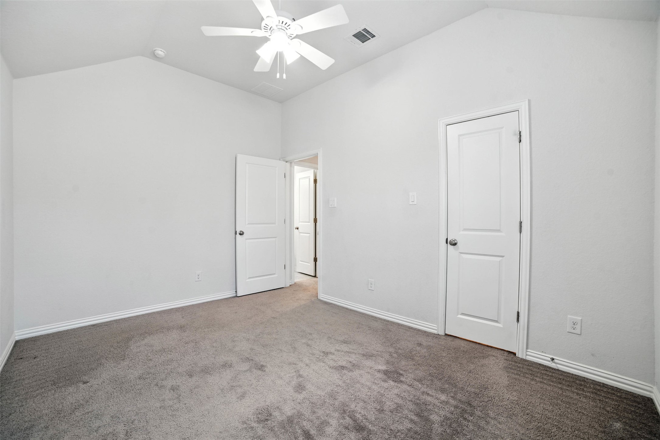 3054 Columbus Loop Round Rock, TX 78665 - Photo 26 of 40 Unfurnished bedroom with vaulted ceiling, carpet flooring, and ceiling fan