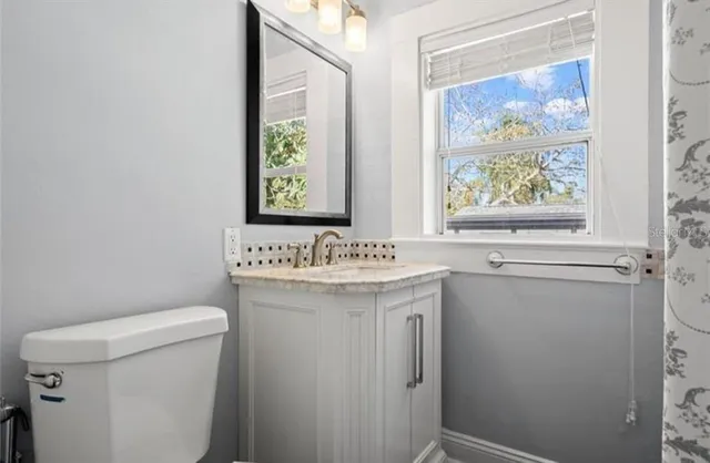 a view of bathroom with a sink and a toilet