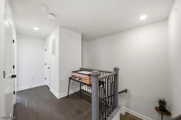 a view of a room with wooden floor and sink