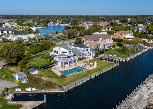 an aerial view of a house with a ocean view
