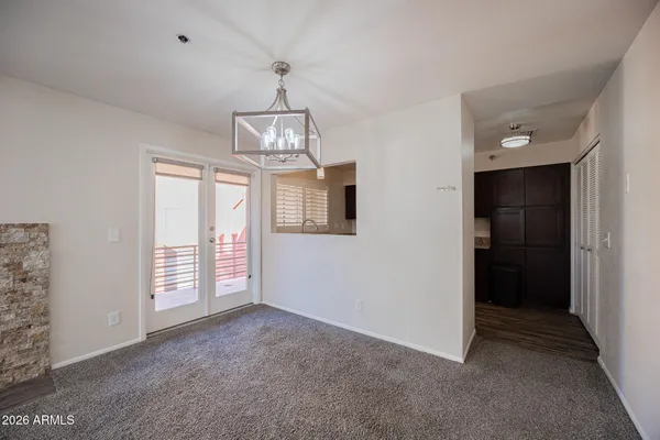en empty room with windows and pillars