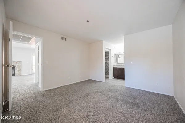 a view of a big room with closet and a bathroom