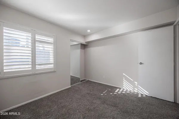 a view of an empty room and a window