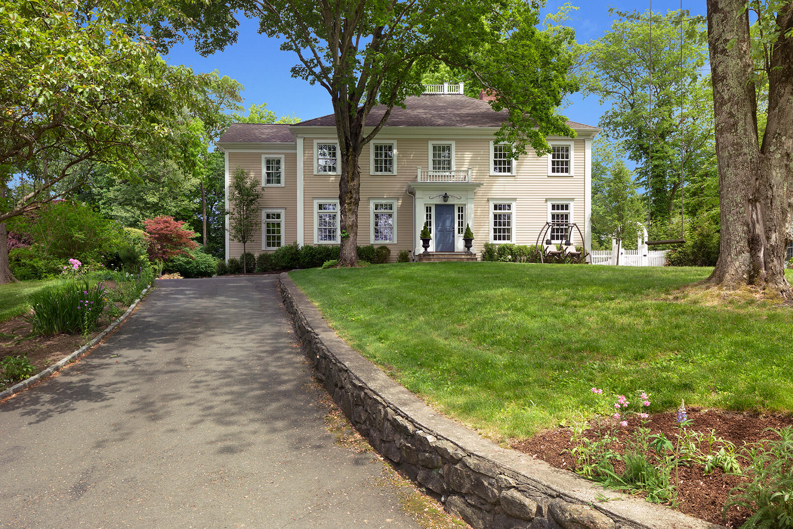 21 Briar Brae Road Darien, CT 06820 - Photo 1 of 35 a front view of a house with a garden