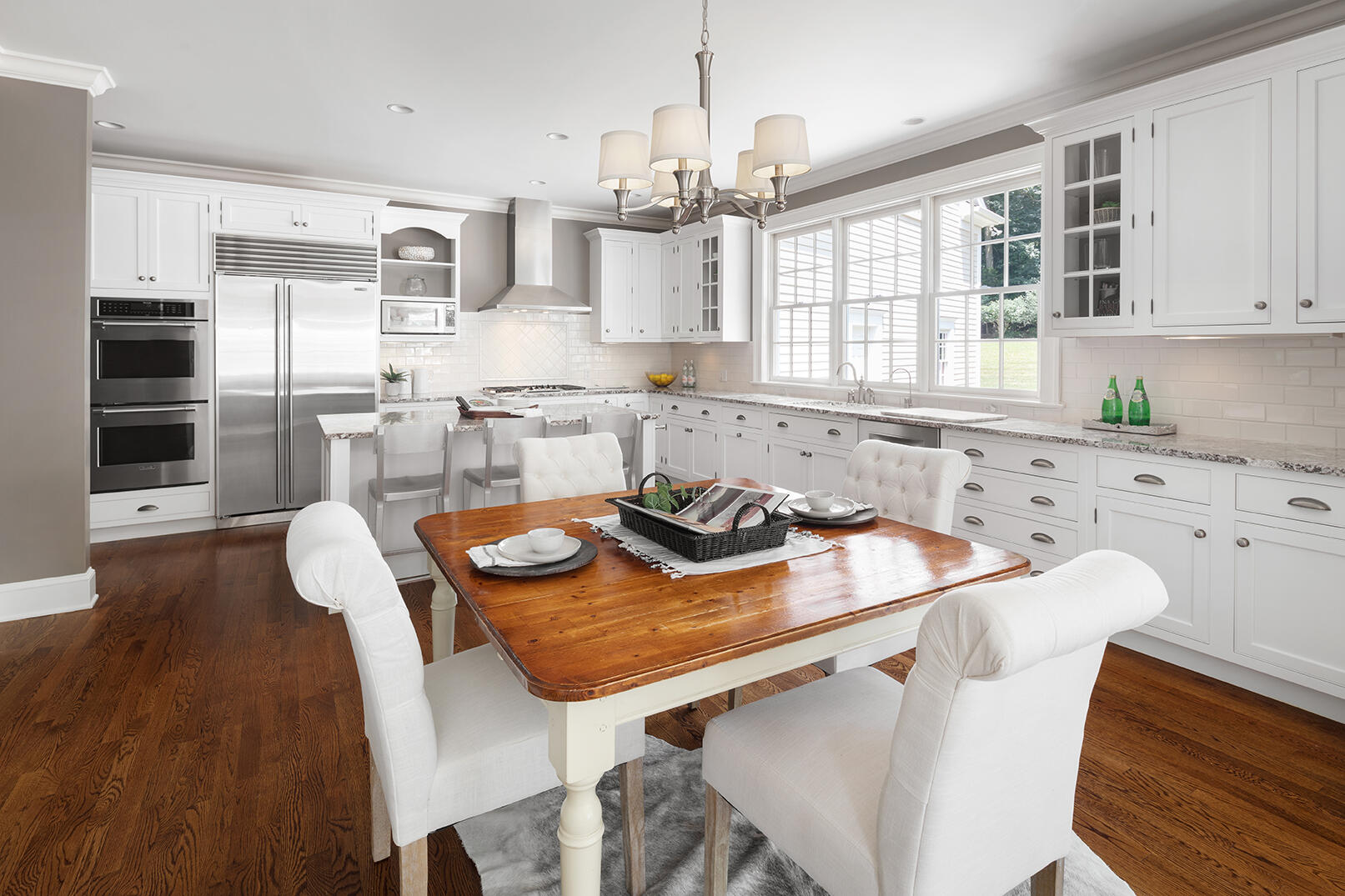 21 Briar Brae Road Darien, CT 06820 - Photo 12 of 35 a kitchen with a sink and chairs